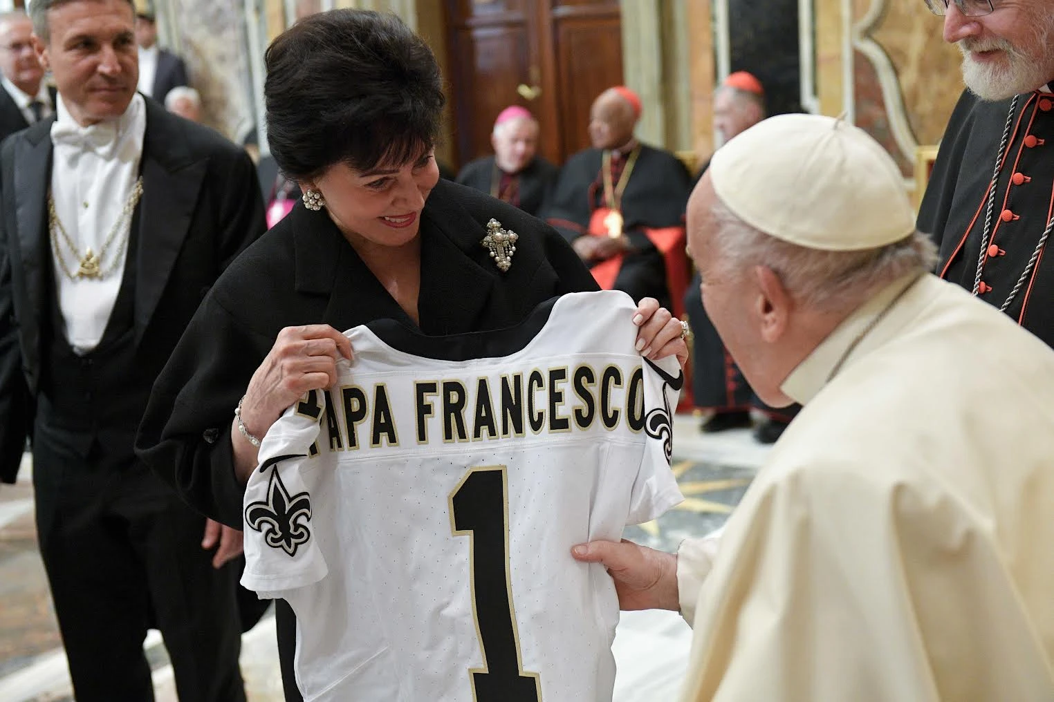 A member of the Papal Foundation greets Pope Francis with a personalized New Orleans Saints jersey, Friday, April 12, 2024.?w=200&h=150