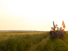 Eighteen thousand pilgrims make their way to Chartres through the French fields at sunrise during the 2024 Paris to Chartres pilgrimage.