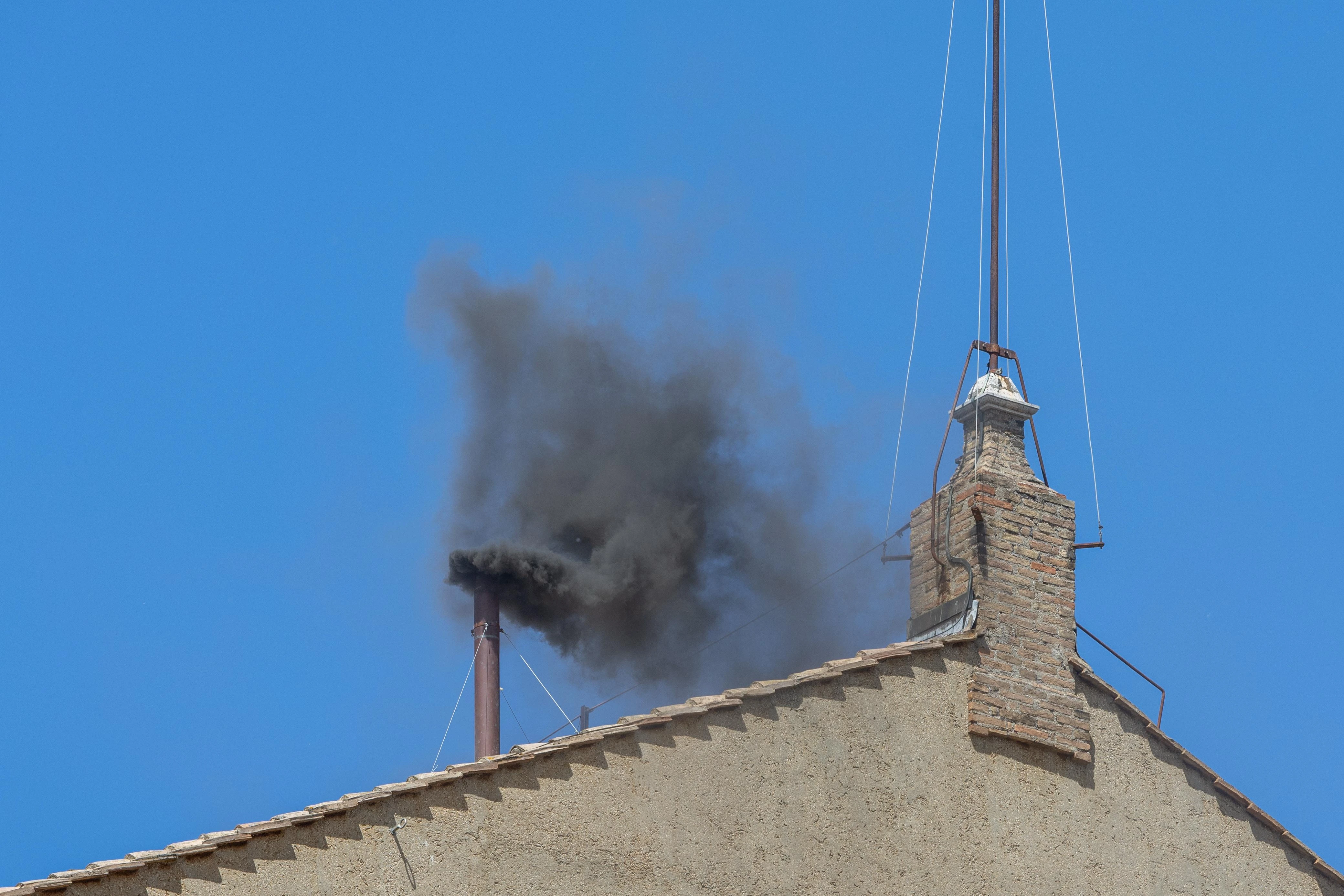Black smoke billows from the chimney at 11:53 a.m. local time over St. Peter’s Square on May 8, 2025.?w=200&h=150