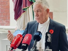 Cardinal John Dew speaking during a press conference in Wellington, New Zealand