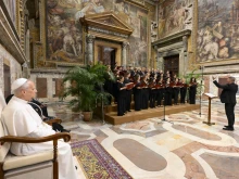 Pope Leo XIV listens to the choir during an audience with participants of an event organized by the Domenico Bartolucci Foundation on June 18, 2025.