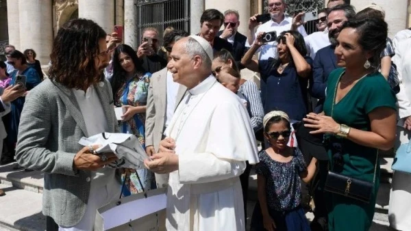 Actor Jonathan Roumie gives Pope Leo XIV a gift on behalf of the entire cast and crew of “The Chosen” after the general audience on Wednesday, June 25, 2025, in St. Peter’s Square at the Vatican. Credit: Vatican Media