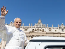 Pope Leo XIV waves from the popemobile at the crowds gathered in St. Peter's Square for Mass on Pentecost Sunday on June 8, 2025.