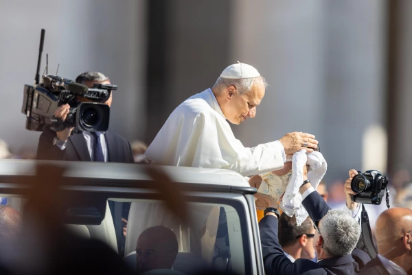 Pope Leo XIV blesses a baby at the Wednesday general audience in St. Peter's Square, Wednesday, June 25, 2025. Credit: Daniel Ibáñez/CNA