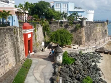 Scene of the walled city of Old San Juan, Puerto Rico. The oldest governor’s mansion under the American flag, La Fortaleza, is top right.