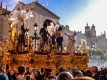 The Mystery of the Brotherhood of San Benito processes through the surroundings of the cathedral of Seville on Holy Tuesday, April 15, 2025.
