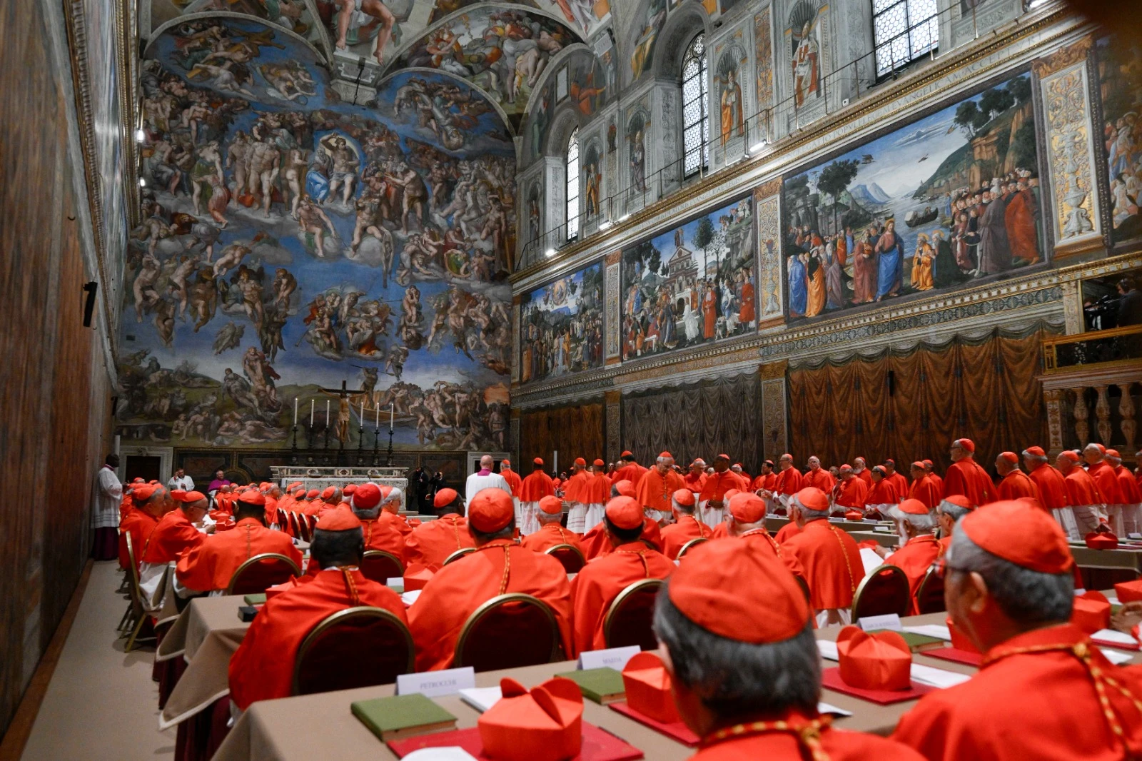 Cardinals prepare to begin the conclave to elect a new pope in the Sistine Chapel on May 7, 2025.?w=200&h=150
