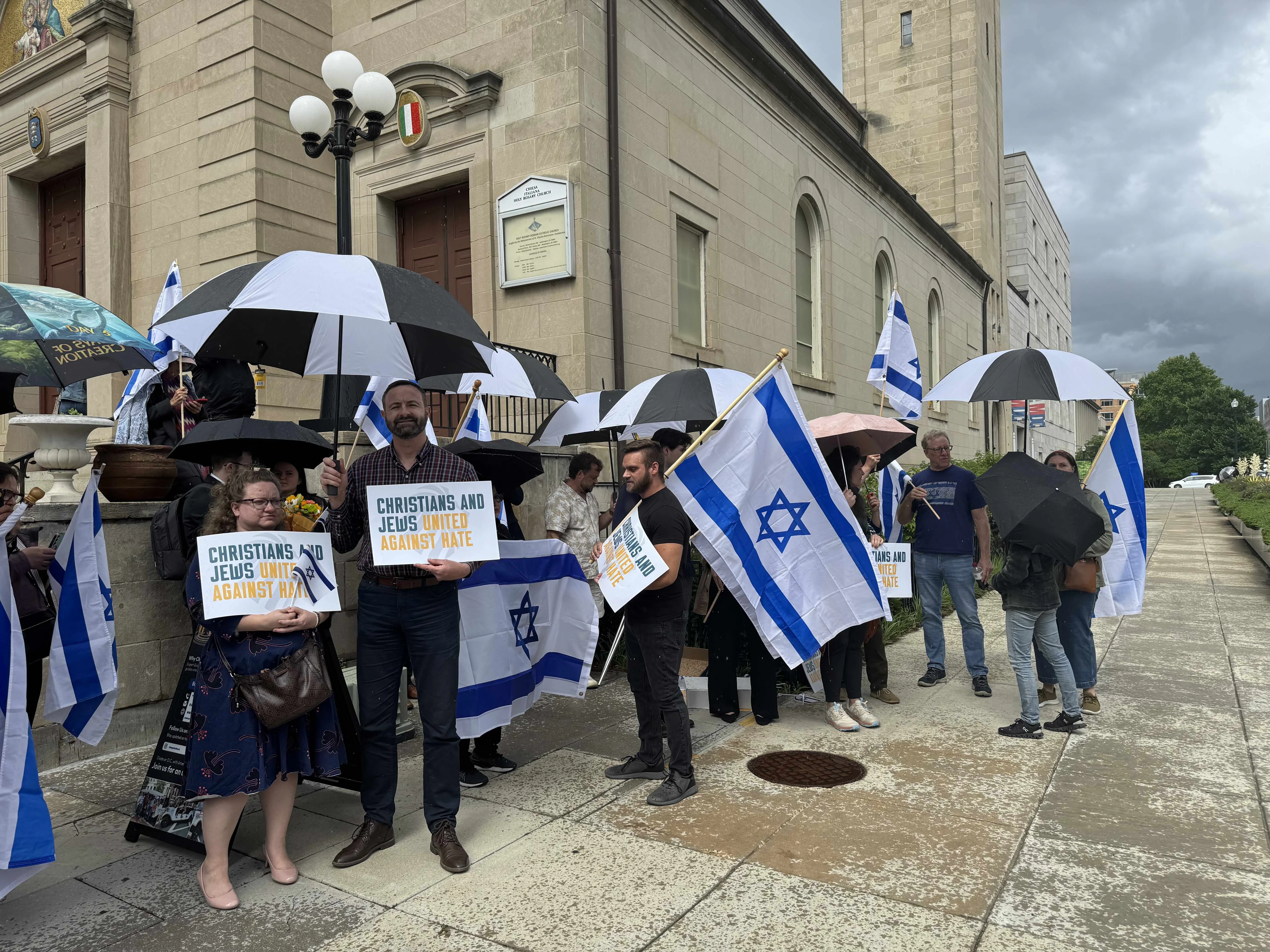 Participants at a May 22, 2025, afternoon vigil to honor the two lives lost in an attack outside the Capital Jewish Museum in Washington, D.C., the night before hold signs reading “Christians and Jews united against hate.”?w=200&h=150