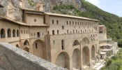 One unique feature of the monastery at Subiaco is that it was built into the mountain. In any room, at least one wall is bare rock. During construction, the connection with the mountain was always preserved. Even above the main altar of the upper church, the rock juts out and looms overhead, enveloping the worship space like a vast cloak.
