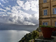 The Vatican Gardens at Castel Gandolfo is located on the wooded slopes of the Alban Hills, overlooking the blue waters of a small volcanic crater lake.