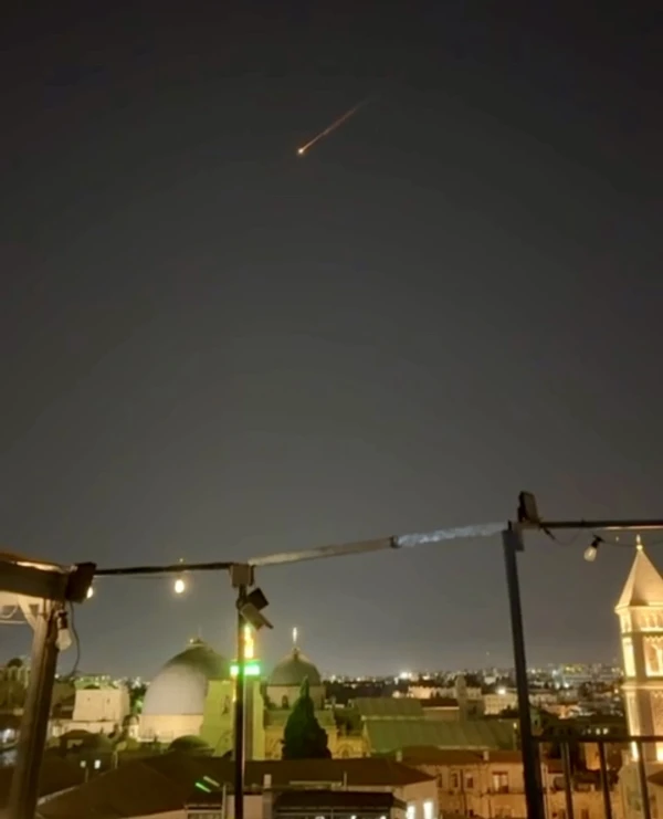 Watching missiles being intercepted in the sky from the rooftop of the hostel overlooking the Old City of Jerusalem and the Holy Sepulchre. Credit: Cameron Mumford