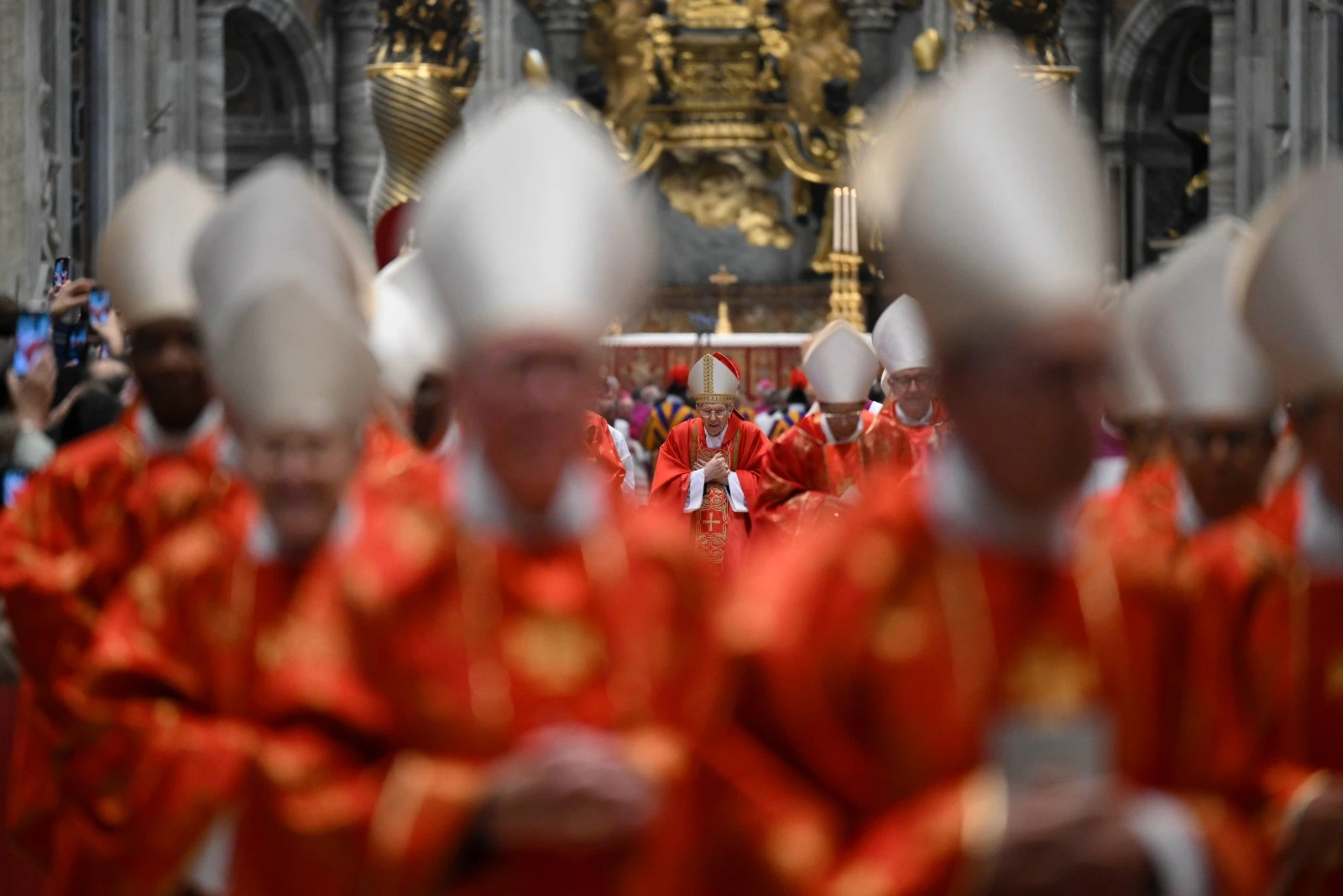 Cardinal electors in their distinctive red vestments attend the Mass for the election of the Supreme Pontiff at St. Peter's Basilica on May 7.?w=200&h=150