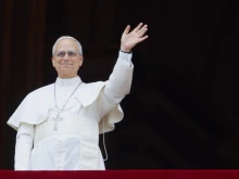 Pope Leo XIV waves at a massive, jubilant crowd gathered on St. Peter’s Square for the Regina Caeli on Sunday, May 11, 2025.