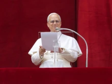 Pope Leo XIV smiles as a jubilant crowd joins in prayer on Sunday, May 11, 2025.
