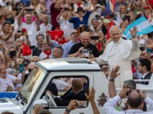 Pope Leo XIV greets the faithful at a Pentecost prayer vigil in St. Peter's Square, Saturday, June 7, 2025