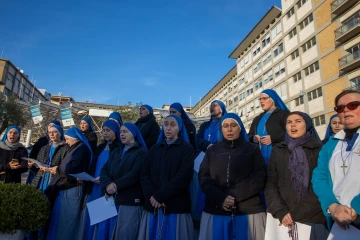 Religious sisters lead the rosary for Pope Francis outside Rome's Gemelli hospital on Saturday afternoon, Feb. 22, 2025.