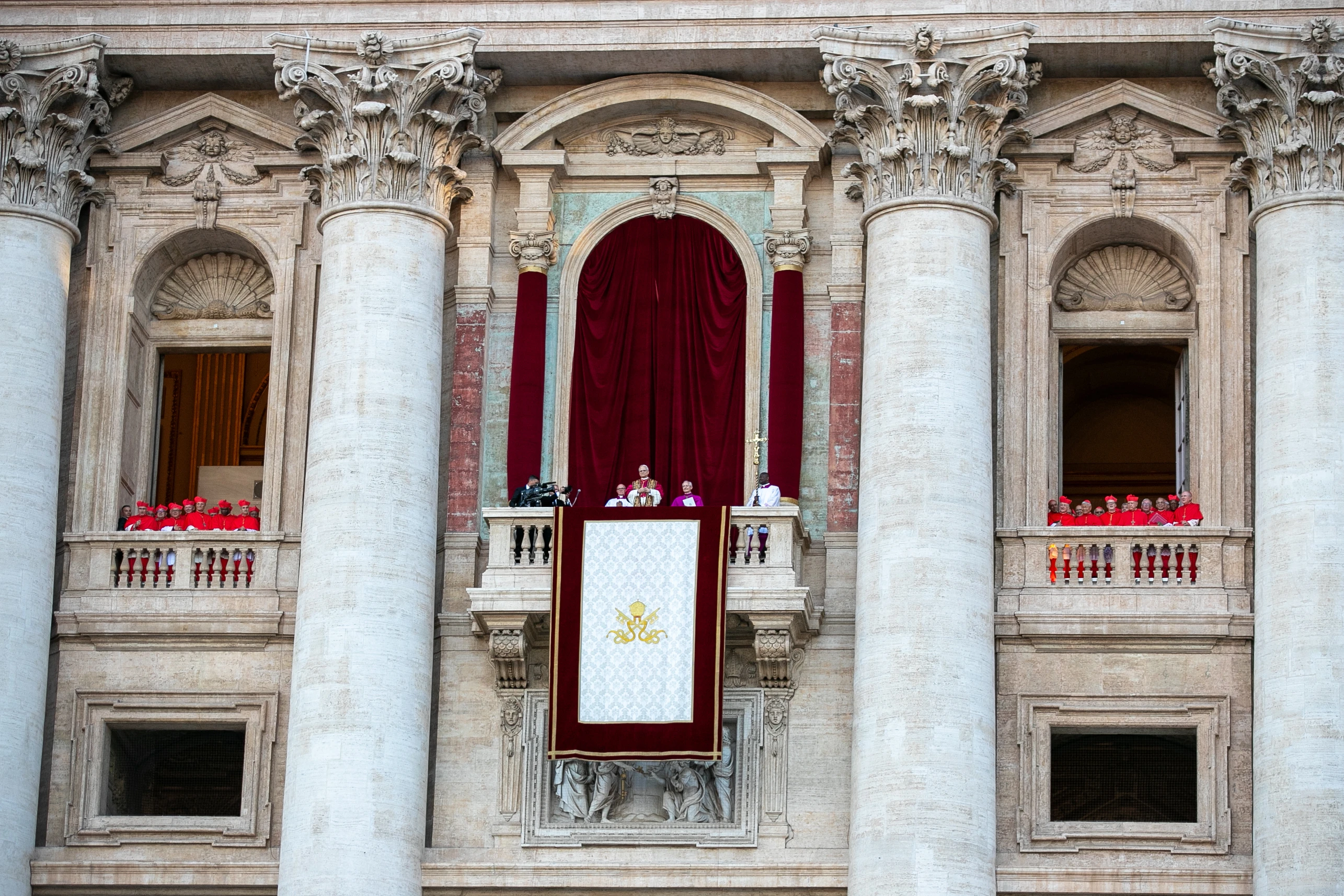 Pope Leo XIV is seen flanked by cardinals at St. Peter’s Basilica shortly after his election, Thursday, May 8, 2025.?w=200&h=150