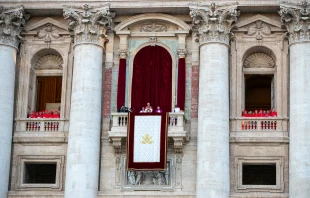Pope Leo XIV is seen flanked by cardinals at St. Peter’s Basilica shortly after his election, Thursday, May 8, 2025. Credit: Daniel Ibáñez/CNA