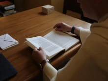 Dominican Father Thomas Joseph White reads the thesis of then-Father Robert Prevost, now Pope Leo XIV, titled “The Role of the Local Prior in the Order of St. Augustine,” which Prevost wrote while a student at Rome’s Pontifical University of St. Thomas Aquinas in the early 1980s.