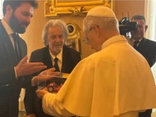 Actor Al Pacino and Italian film producer Andrea Iervolino give Pope Leo XIV a miniature model of a Maserati car during a private audience at the Vatican on June 17, 2025.