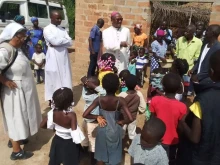 Bishop Maurício Agostinho Camuto of the Diocese of Caxito in Angola greets children at Our Lady of the Assumption Parish of his Episcopal See.