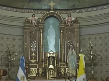 The image of the statue of Our Lady of Lourdes that is seen but is not there.