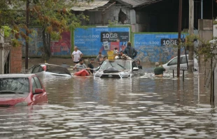 People gather on a flooded street after a powerful storm struck the city of Bahia Blanca, 373 miles south of Argentina’s capital, on March 7, 2025. Credit: PABLO PRESTI/AFP via Getty Images