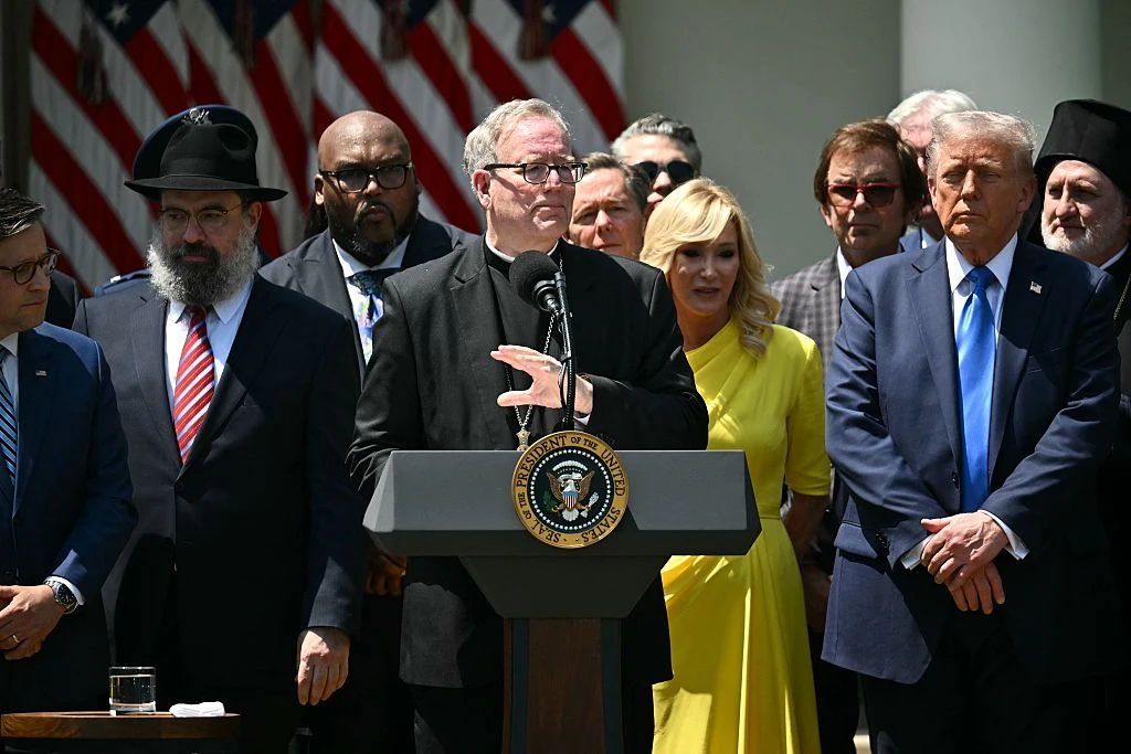 Bishop Robert Barron speaks alongside President Donald Trump (right) during a National Day of Prayer event on May 1, 2025, in the Rose Garden of the White House in Washington, D.C.?w=200&h=150