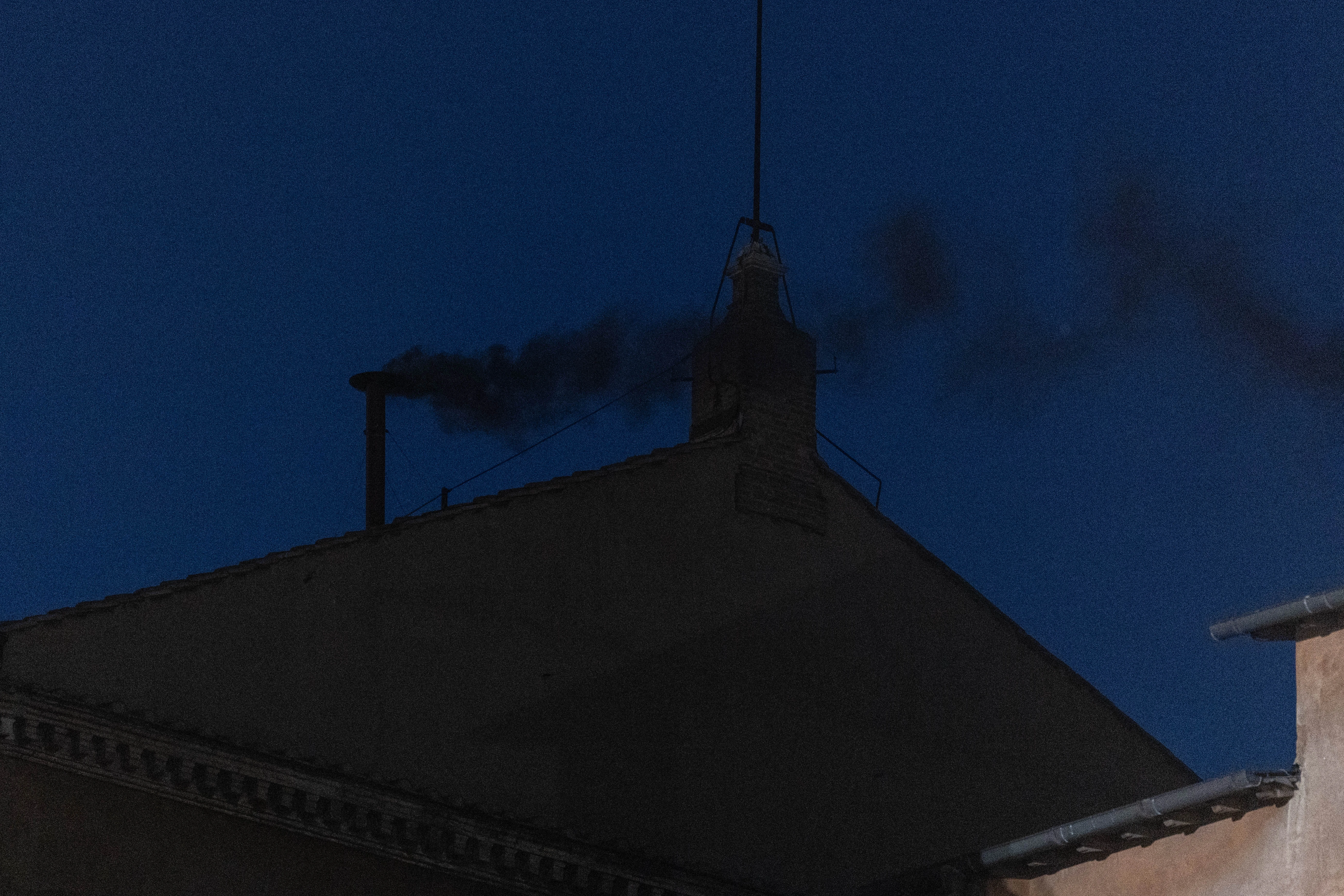 Black smoke issues from the chimney of the Sistine Chapel, signaling that no pope has yet been elected, Wednesday, May 7, 2025.?w=200&h=150