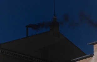 Black smoke issues from the chimney of the Sistine Chapel, signaling that no pope has yet been elected, Wednesday, May 7, 2025. Credit: Daniel Ibáñez/CNA