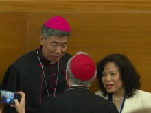 Shanghai Bishop Joseph Shen Bin speaks to Vatican Secretary of State Cardinal Pietro Parolin at a Vatican conference on Wednesday, May 22, 2024.