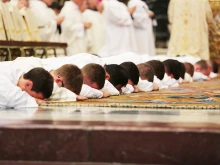 Ordinandi lie prostrate during the Litany of Saints during an ordination Mass in St. Peter’s Basilica on Sept. 29, 2016.