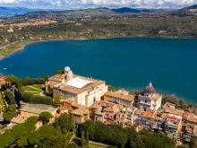 An aerial view of the papal palace of Castel Gandolfo near Rome. The apostolic palace is a complex of buildings served for centuries as a summer residence for the pope and overlooks Lake Albano.