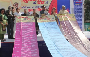 Activists display a long list of atrocities against minorities on the first 300 days of the Narendra Modi government on March 19, 2015. Credit: Anto Akkara