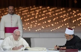 Pope Francis and Grand Imam Ahmed al-Tayeb sign the Document on Human Fraternity for World Peace and Living Together in 2019 . Credit: Vatican Media