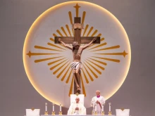 Pope Francis presides beneath a crucifix at Mass at Singapore National Stadium, Thursday, Sept. 12, 2024