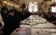 Mourners gather at the Church of the Holy Cross in Qassaa, Damascus, on June 24, 2025, around white caskets of some of the worshippers who lost their lives in a terrorist attack at the Mar Elias Church in the Dweila neighborhood of Syria’s capital on Sunday, June 22, 2025.