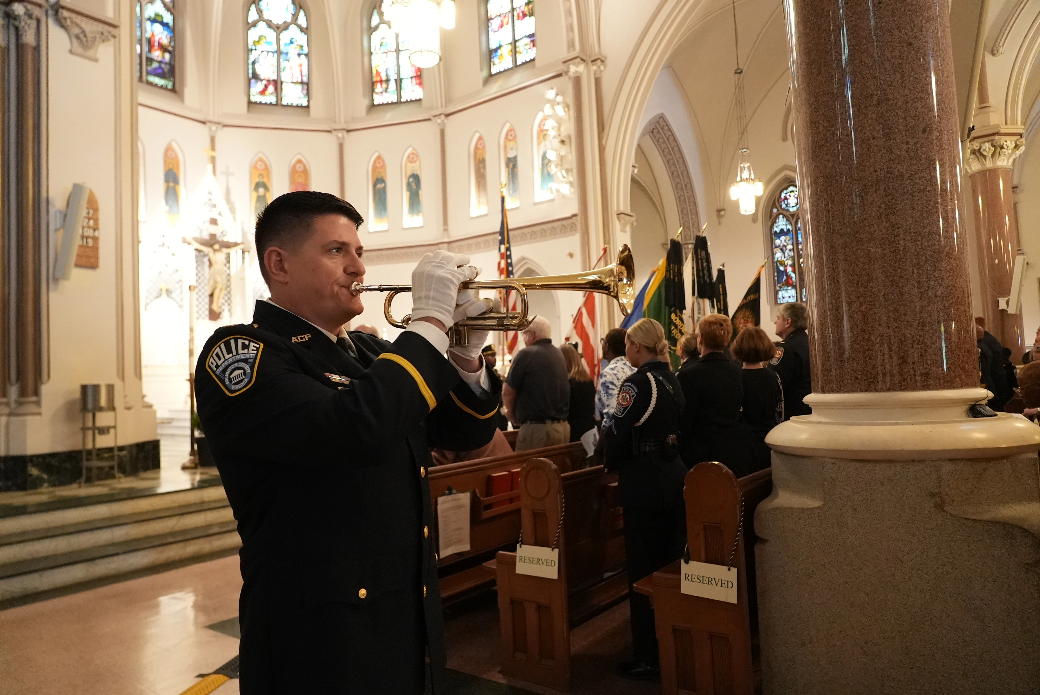Lt. Matt Owens of the Arlington County Police Department plays the bugle in honor of fallen service members, at the annual Blue Mass on Tuesday May 6, 2025, at St. Patrick Cathlolic Church in Washington, D.C.?w=200&h=150
