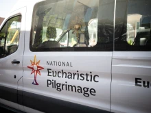 The Blessed Sacrament is seen through the window of the National Eucharistic Pilgrimage van moments before departure from St. John the Evangelist Church in Indianapolis on May 18, 2025.