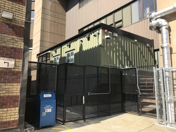 The MAID facility at St. Paul’s Hospital is attached to an exterior wall, facing the courtyard. Public access to the facility from the courtyard is blocked by a locked gate and a 2-yard-high, black chain-link fence. Credit: Terry O’Neill