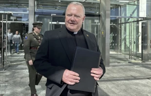 Father Paul Murphy exits the Central Criminal Court in Dublin on Thursday, April 10, 2025, after giving a victim impact statement in a sentencing hearing for a boy who stabbed him. Credit: Press Association via AP Images
