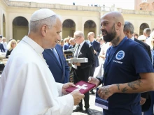 Pope Leo XIV speaks to an anti-drug advocate at the Apostolic Palace in Vatican City, Thursday, June 26, 2025