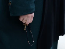 An attendee prays the rosary during a demonstration called by the association “La Marche pour la vie” against abortion and euthanasia in Versailles, southwest of Paris, on March 4, 2024.