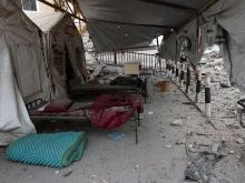Beds sit amid the debris in the aftermath of an Israeli strike on the Al-Ahli hospital, also known as the Baptist or Ahli Arab hospital, in Gaza City on April 13, 2025.