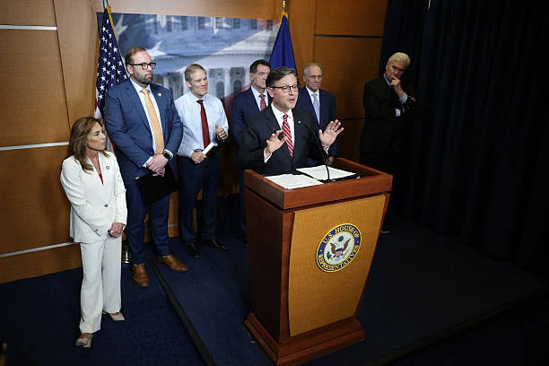 Speaker of the House Rep. Mike Johnson speaks as (left to right) House Republican Conference Chair Rep. Lisa McClain, Rep. Jason Smith, Rep. Jim Jordan, Rep. Mark Green, House Majority Leader Rep. Steve Scalise, and House Majority Whip Rep. Tom Emmer listen during a news briefing after a House Republican Conference meeting with President Donald Trump at the U.S. Capitol on May 20, 2025, in Washington, D.C.?w=200&h=150