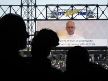 Pope Leo XIV addresses Catholic faithful on the scoreboard at Rate Field, home to the Chicago White Sox, during a celebration and Mass on June 14, 2025, in Chicago to honor his selection as pope.