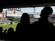 Pope Leo XIV addresses Catholic faithful on the scoreboard at Rate Field, home to the Chicago White Sox, on June 14, 2025, in Chicago during a celebration and Mass to honor his selection as pope.