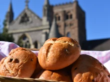 According to Stephen de Silva, St. Albans Cathedral’s longest-serving guide of more than 45 years, religious brothers who lived in the cathedral’s abbey in the 14th century invented the original hot cross bun for both charitable and catechetical reasons.