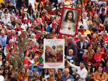 Thousands celebrate the beginning of Holy Week on April 13, 2025, with a Palm Sunday procession in Qaraqosh, Iraq.
