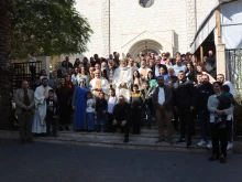 Group photo in front of the Church of the Sacred Family in Gaza during the visit of the Latin Patriarch of Jerusalem, Cardinal Pierbattista Pizzaballa, on Dec. 22, 2024.